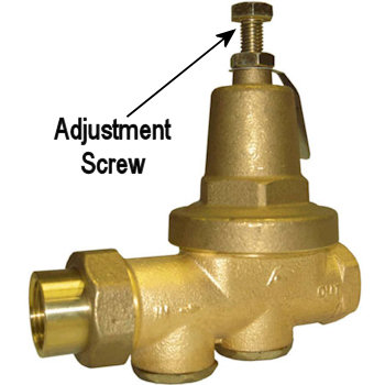 Photo of a bell-shaped Pressure Reducing Valve (PRV) installed on a water line
